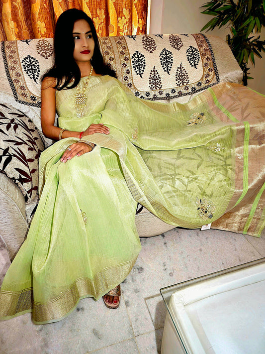 Pastel Green tissue saree with handwork and zari border