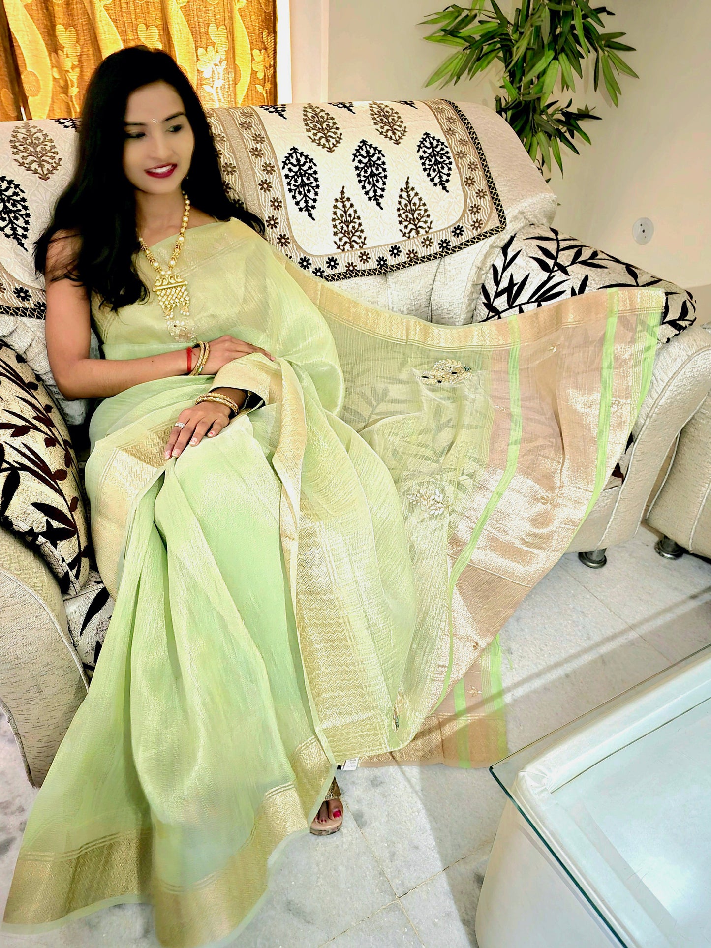 Pastel Green tissue saree with handwork and zari border