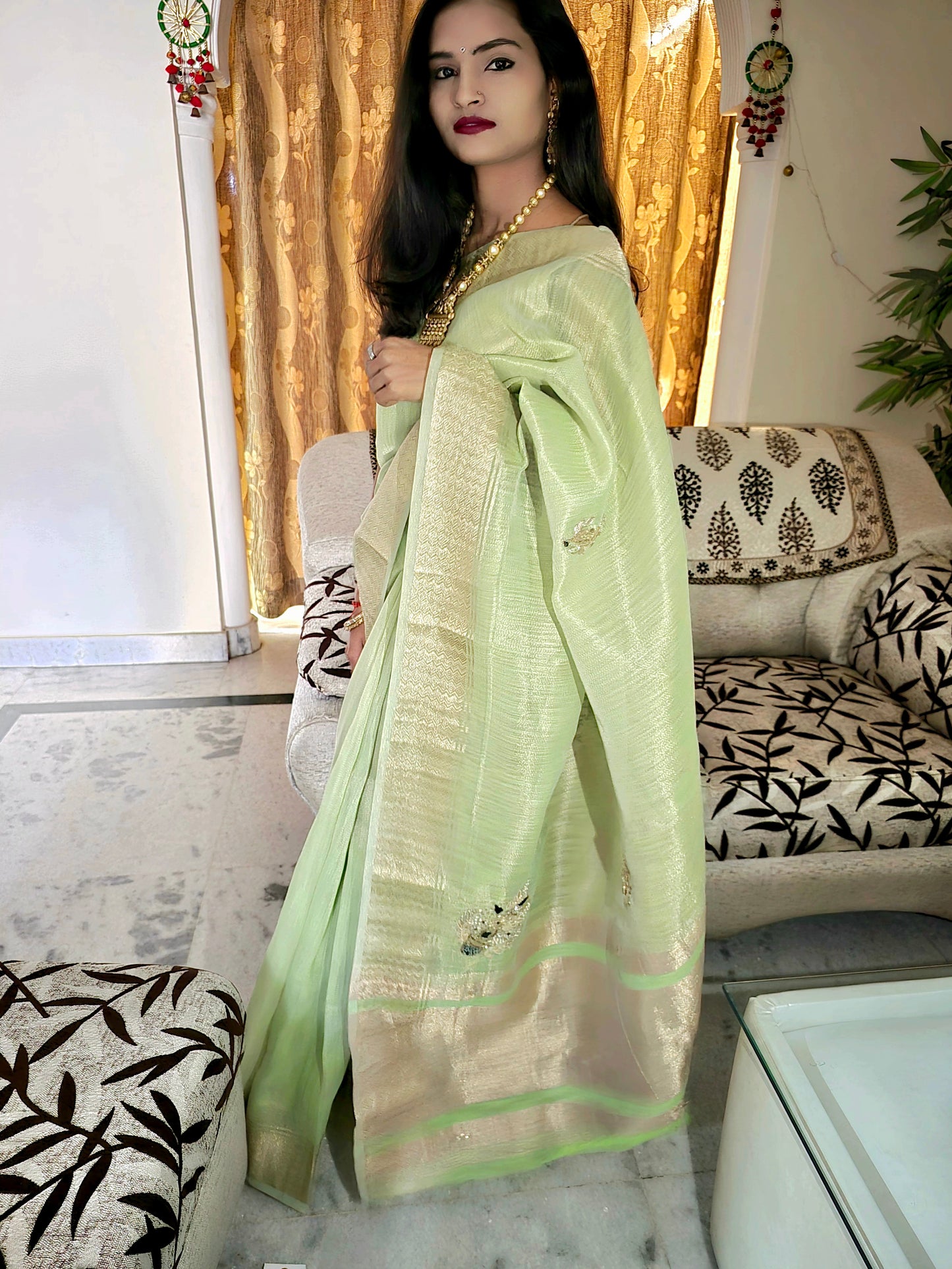 Pastel Green tissue saree with handwork and zari border