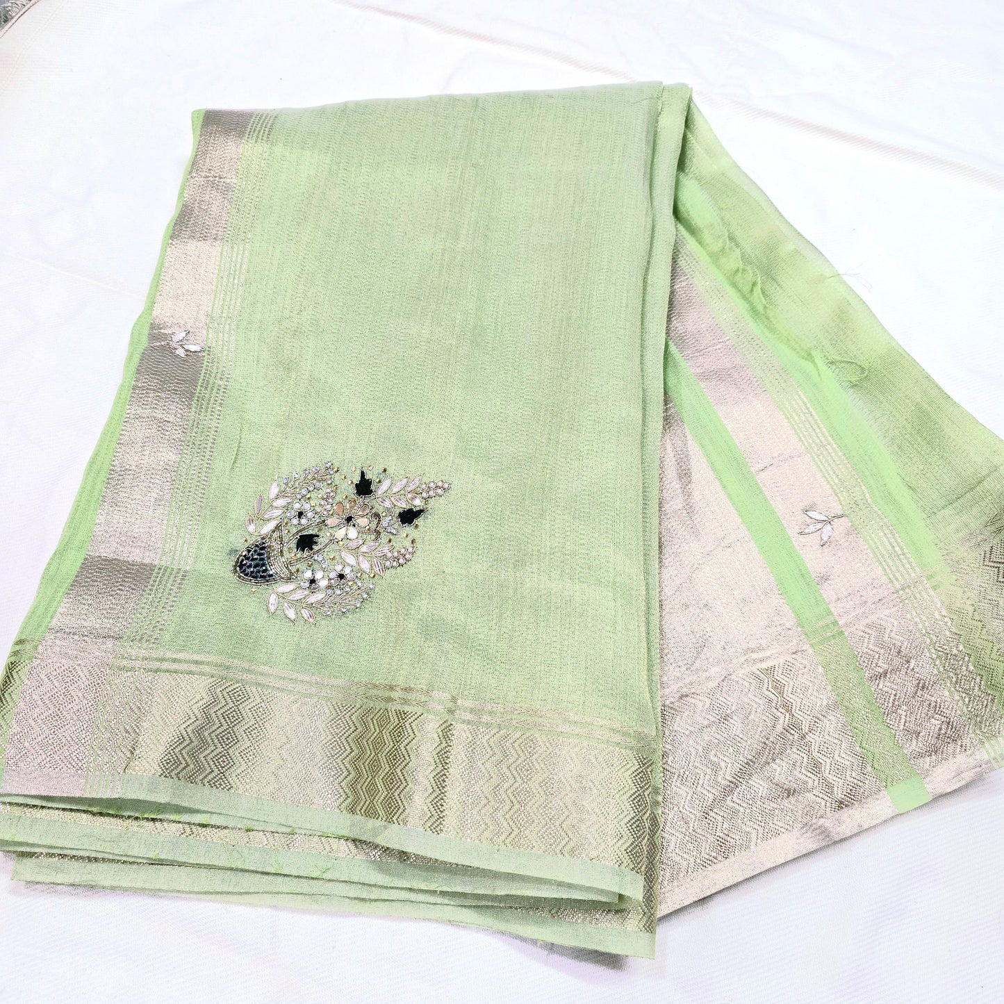 Pastel Green tissue saree with handwork and zari border