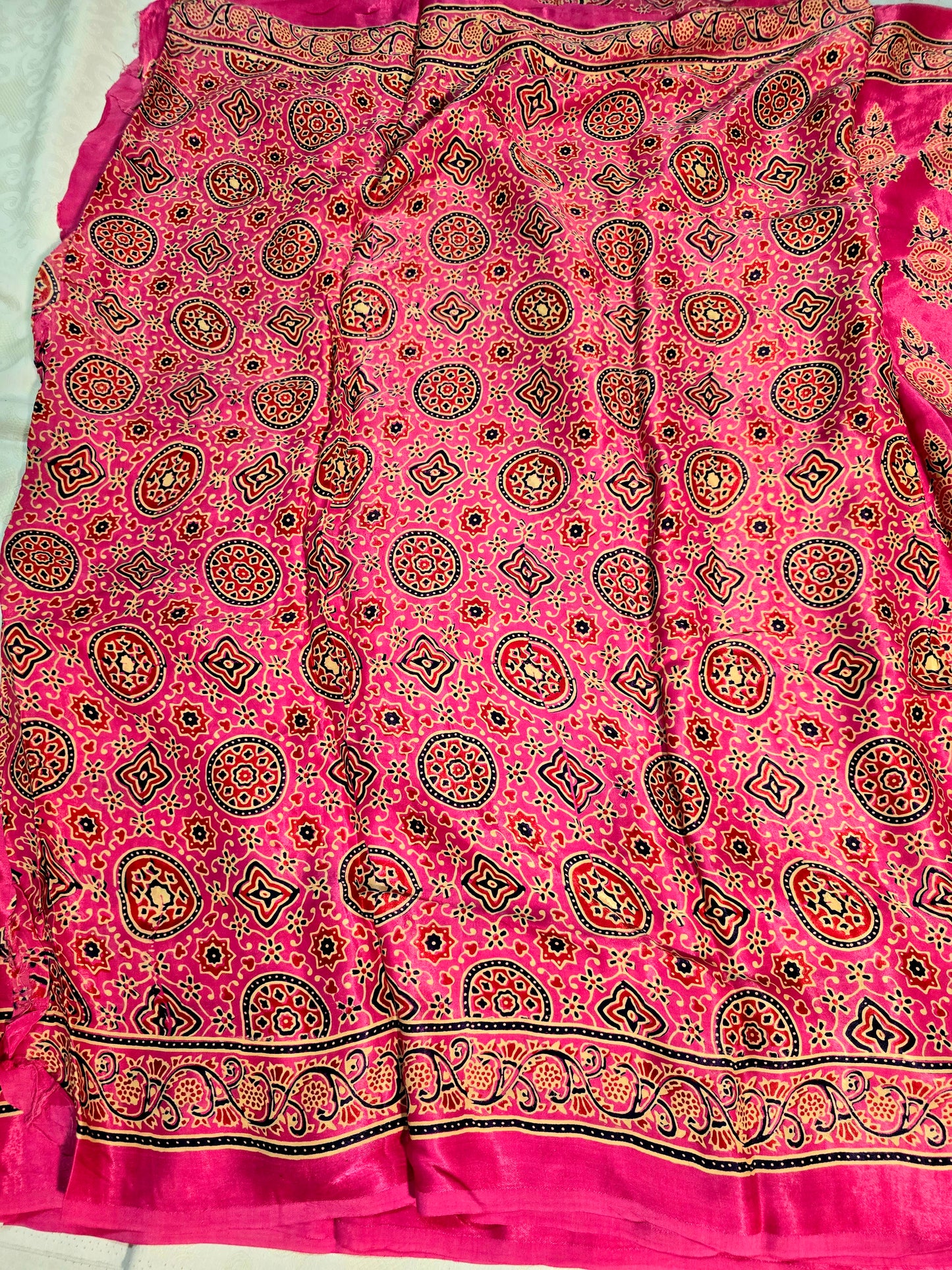 Pink colour ajrakh block printed modal silk saree with tissue pallu