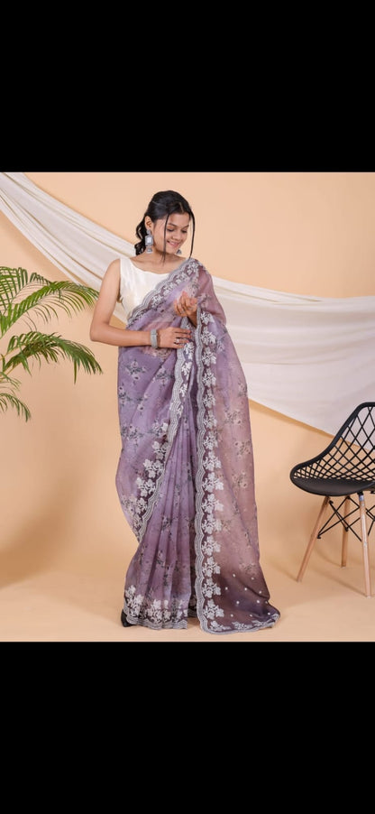 Lavender colour printed soft organza saree with embroided border