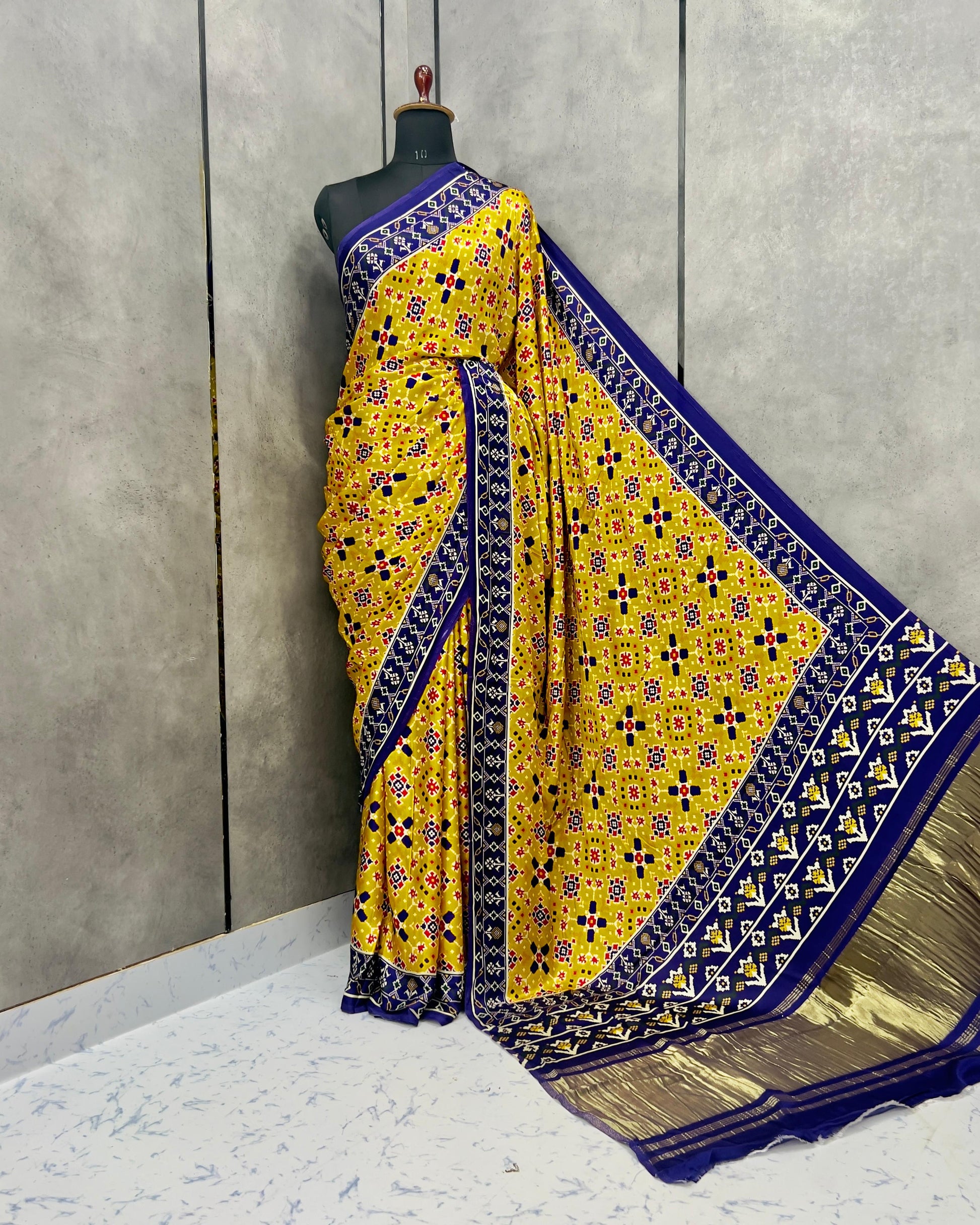 Yellow colour Patola print modal silk saree