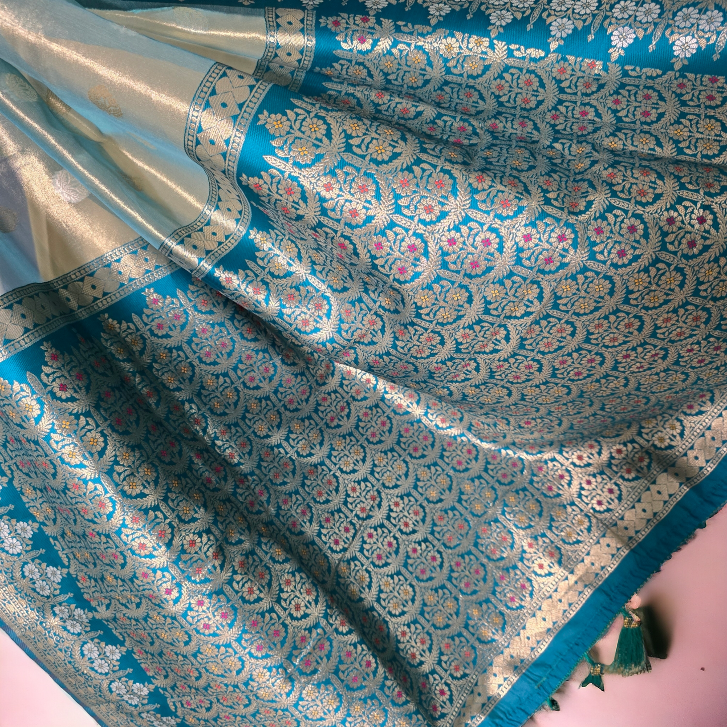 Pastel green paper tissue saree with zari border and pallu