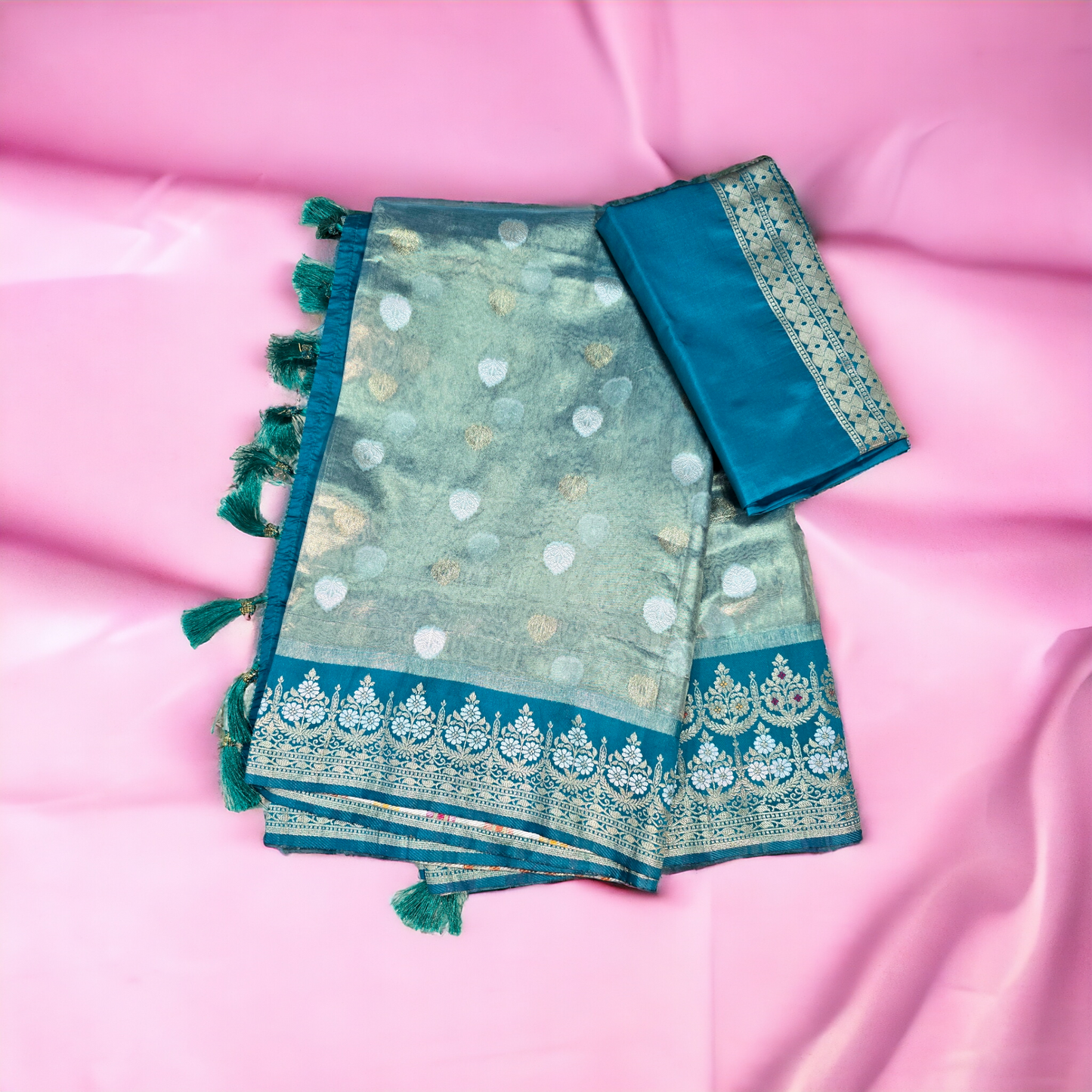 Pastel green paper tissue saree with zari border and pallu