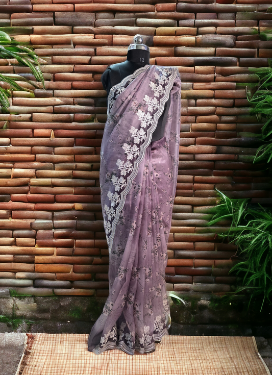 Lavender colour printed soft organza saree with embroided border