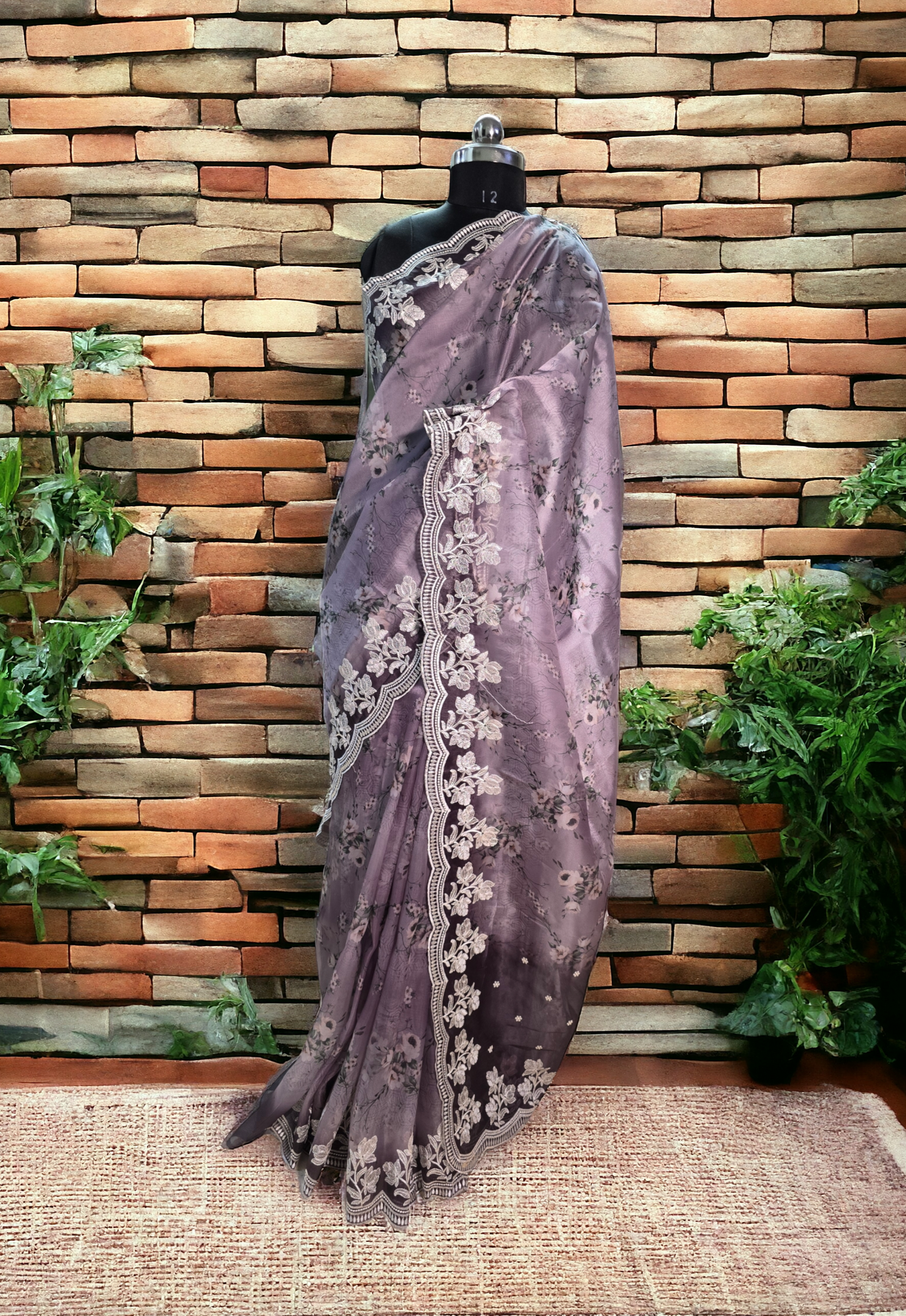 Lavender colour printed soft organza saree with embroided border