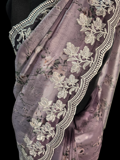 Lavender colour printed soft organza saree with embroided border