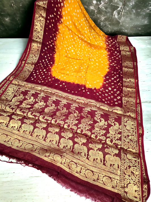 Mustard yellow and maroon bandhej semi gajji sik saree with kanjivaram border and pallu